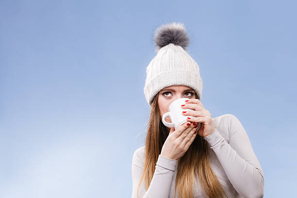 istock girl in thermal underwear drinking tea 637749770
