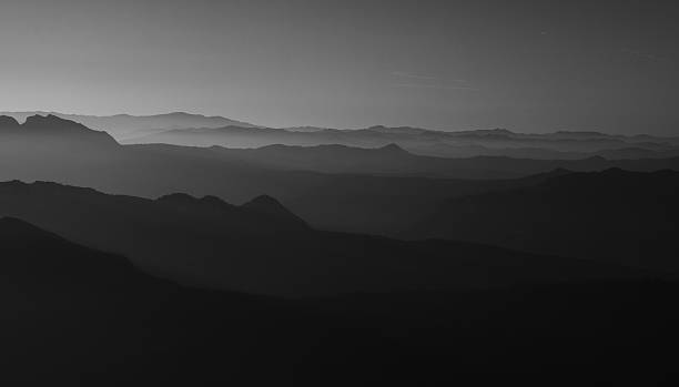 istock Mountains, fog and sunset. 637751046