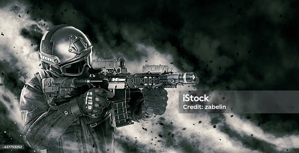 police officer SWAT Spec ops police officer SWAT in black uniform with rifle making his way through the fire. Studio shot on black background. Police assault concept Special Forces Stock Photo