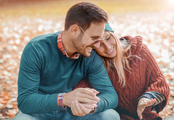 istock Romantic couple in the autumn park 637753274