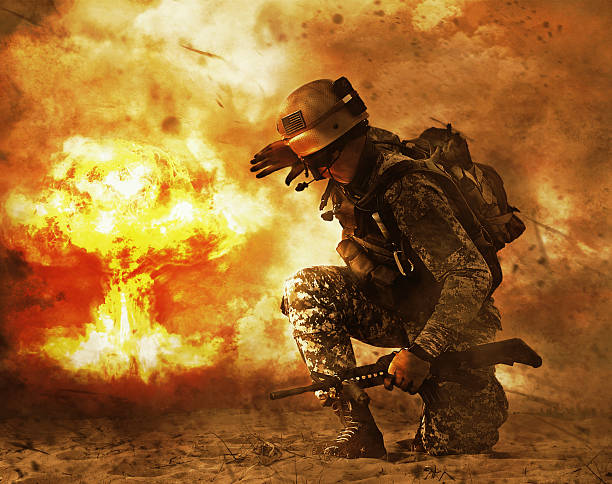 soldier turning to mushroom cloud US soldier in the desert during the military operation turning to nuclear explosion mushroom cloud covering his eyes. He is doomed battlefield photos stock pictures, royalty-free photos & images