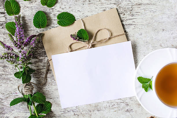 istock Blank white greeting card with wildflowers  and cup of tea 637754202