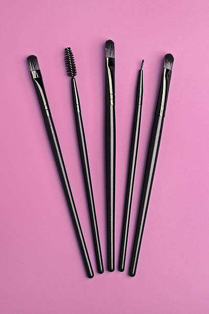 istock Various brushes for make up and art on pink 637754586