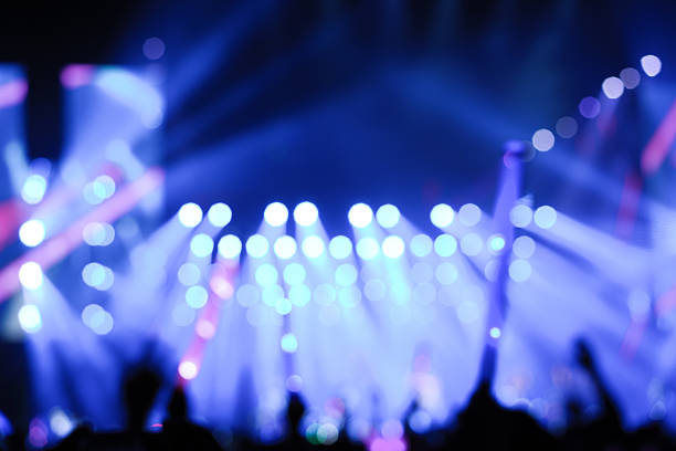 Defocused entertainment concert lighting on stage, blurred disco party and Concert Live.