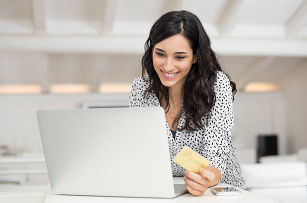 woman paying bill online - internet e mail paying credit card imagens e fotografias de stock