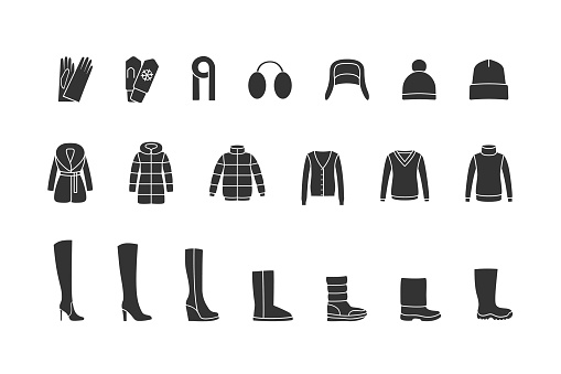 Winter clothes and shoes black icons set. Vector