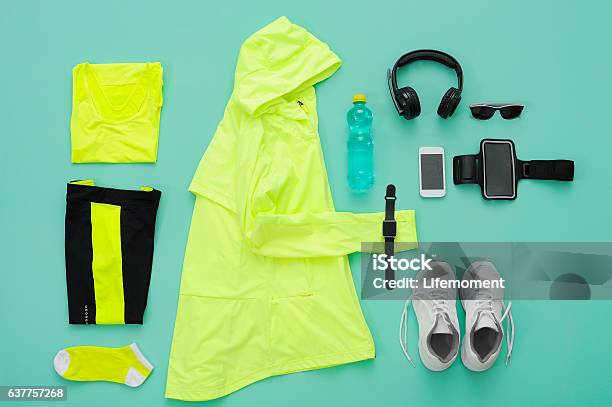 Sports Clothing And Accessories On Turquoise Background Stock Photo - Download Image Now