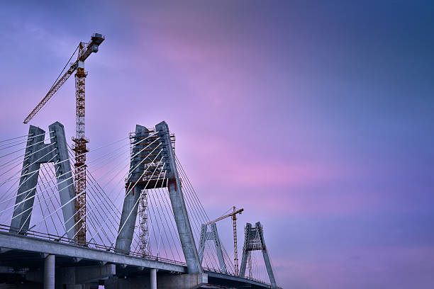 istock Cranes in construction of the cable-stayed bridge. Cracow Poland 637758378