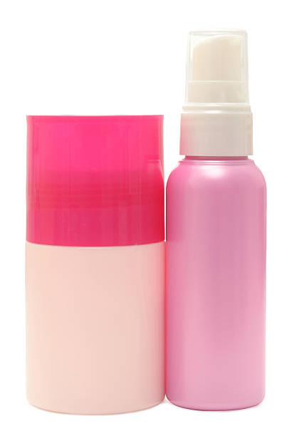 bottiglie cosmetici - vertical studio shot indoors pink foto e immagini stock