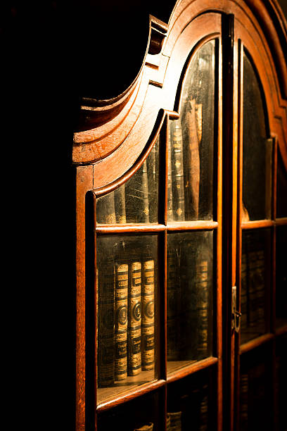 istock Vintage Russian wooden bookcase in the library. 637760102