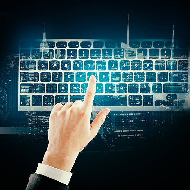 istock Hand with keyboard on city background 637761598