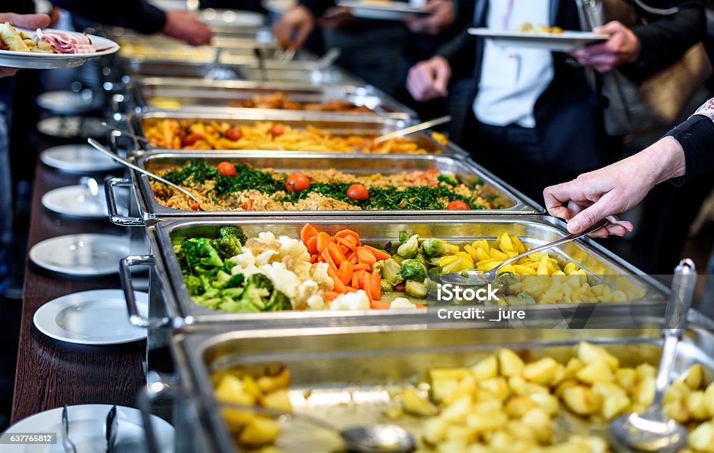 Cuisine Culinary Buffet Dinner Catering Dining Food Celebration Cuisine Culinary Buffet Dinner Catering Dining Food Celebration Party Concept. Group of people in all you can eat catering buffet food indoor in luxury restaurant with meat and vegetables. Buffet Stock Photo