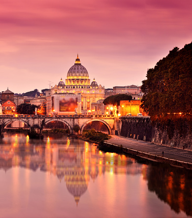 Sunset of St Peter's Basilica tiber river and Rome cityscape, Vatican, Rome, Italy.