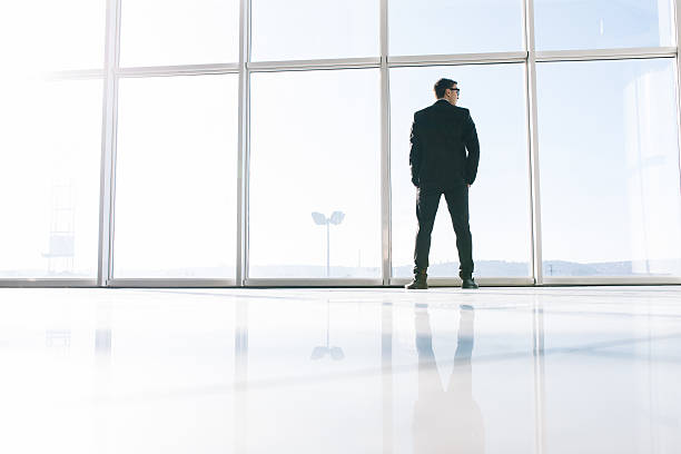 istock Businessman looking at city. 637766344
