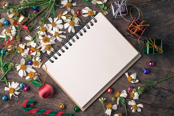 istock Christmas and new year wooden background banner with blank notebook 637766618