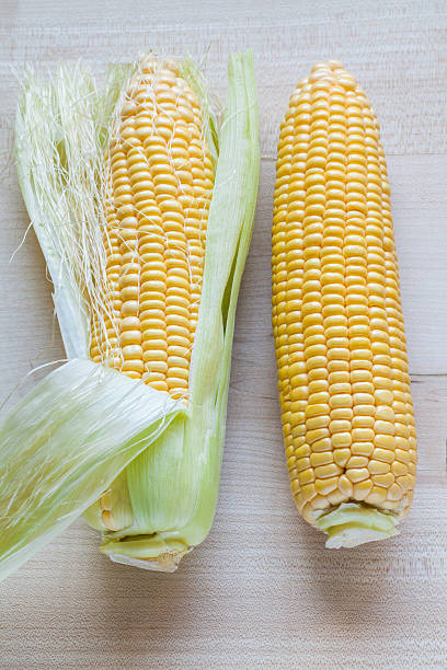 istock Fresh sweet corn on wooden table. 637767420