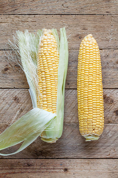 istock Fresh sweet corn on wooden table. 637768804