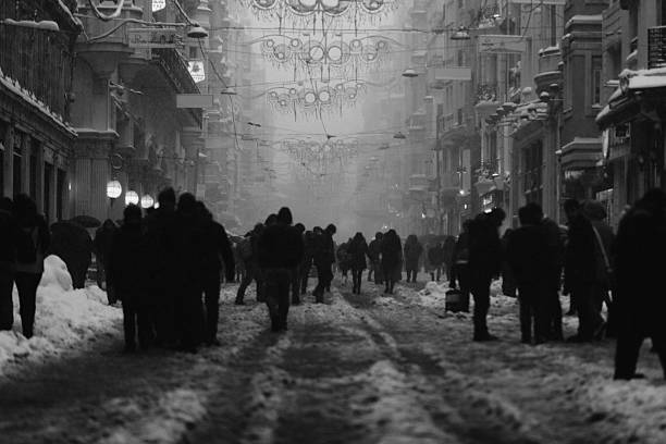 Istiklal street in a snowy winter day in Taksim, Beyoğlu. İstiklal Avenue is one of the most famous avenues in Istanbul, Turkey, visited by nearly 3 million people in a single day over the course of weekends. Black and White XXXL