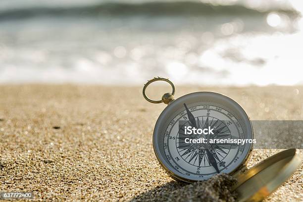 Compass On The Beach Stock Photo - Download Image Now - Navigational Compass, Sea, Sand
