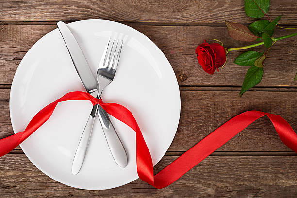istock Valentines day table setting with plate, fork, knife, ribbon and 637772584