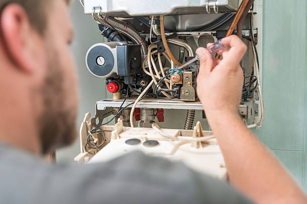 técnico en reparación de gas horno - air conditioner electricity repairing furnace fotografías e imágenes de stock