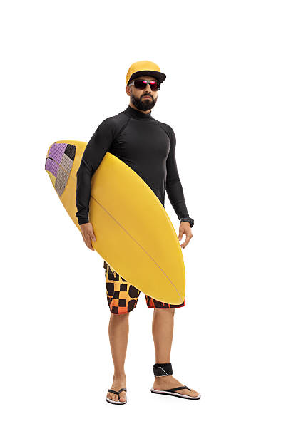 istock Surfer in a wetsuit holding a surfboard 637773146