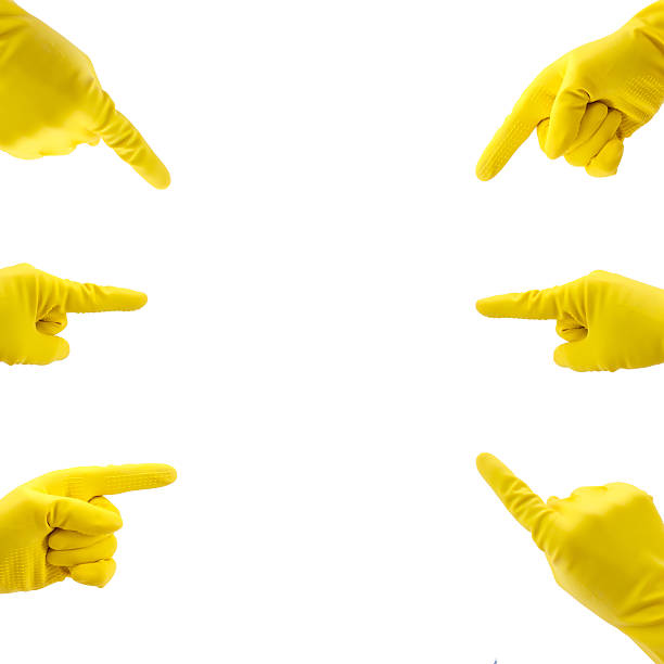 istock Yellow Gloves Pointing To The Middle 637774946
