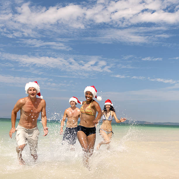 istock Christmas Santa Hat Vacation Travel Beach Concept 637776488