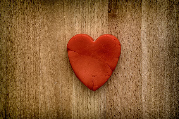 istock Red heart on a wooden background 637779372