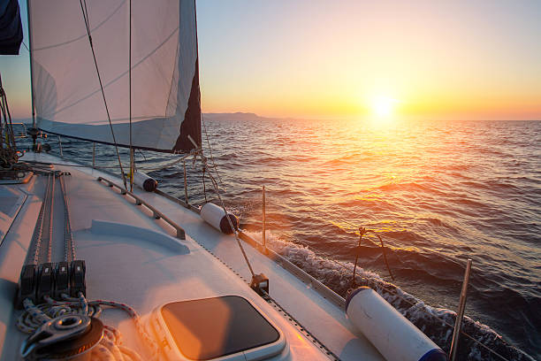 istock Sail yachts in the Sea. Luxury boat during sunset. 637779408
