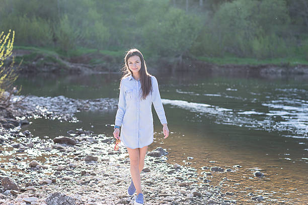 istock woman walking on rocks 637780200