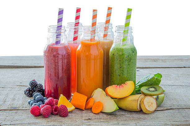 istock Selection of colourful smoothies on rustic wood background 637780294