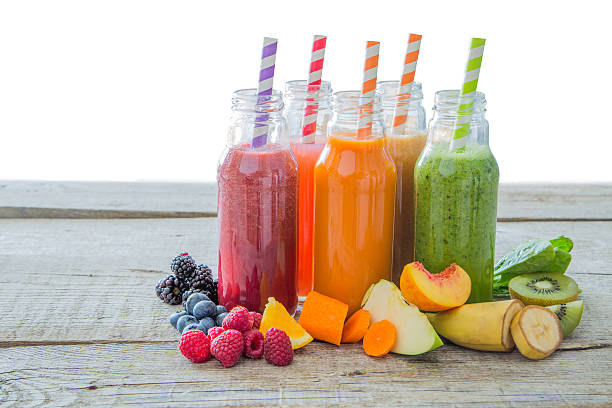 istock Selection of colourful smoothies on rustic wood background 637780628