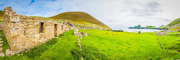Remains of stone cottages along the Village street on the remote island of Hirta in the St. Kilda archipelago far off the Scottish coast in the North Atlantic, a rare double UNESCO World Heritage Site.
