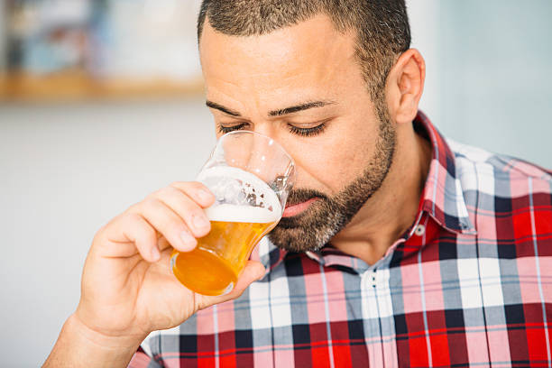 istock Bearded man smelling craft beer 637781394