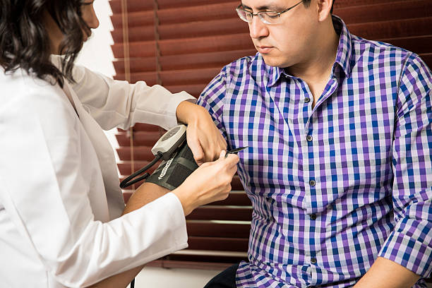 istock Checking blood pressure of patient 637783092