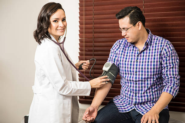 istock Cute female doctor working with patient 637783388