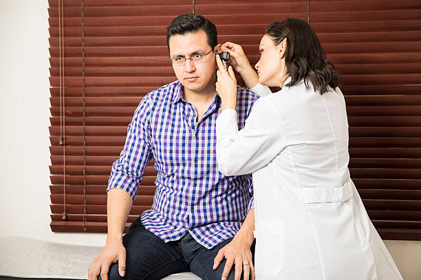 istock Doctor doing a physical exam to patient 637783510