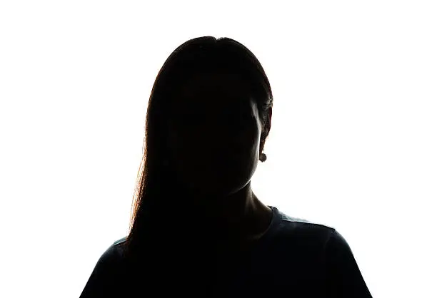 Young woman look ahead with flowing hair - horizontal silhouette of a front view