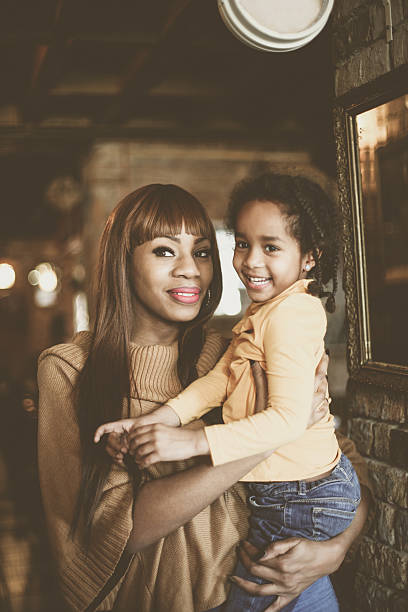 istock African mother and daughter. 637783742