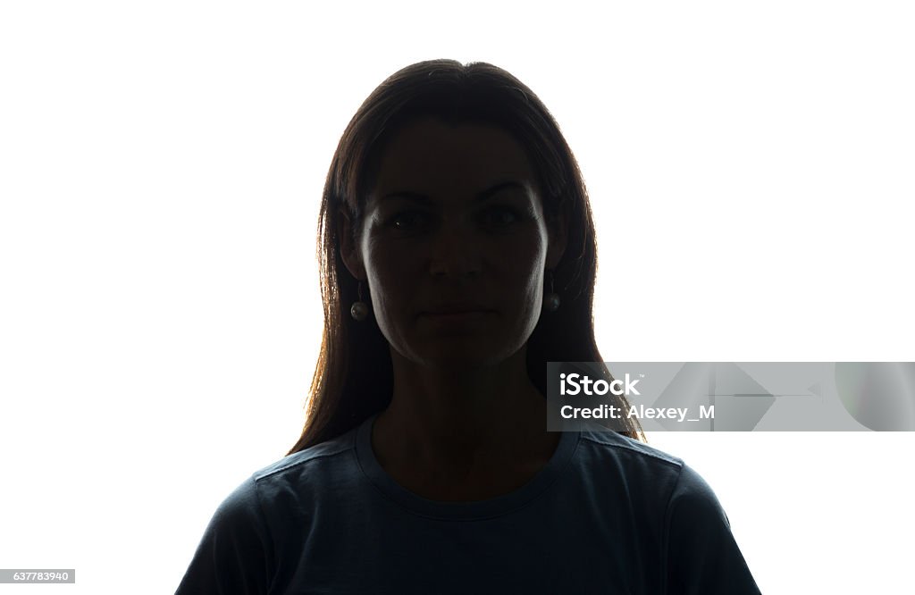 Young woman look ahead with flowing hair - horizontal silhouette Young woman look ahead with flowing hair - horizontal silhouette of a front view In Silhouette Stock Photo