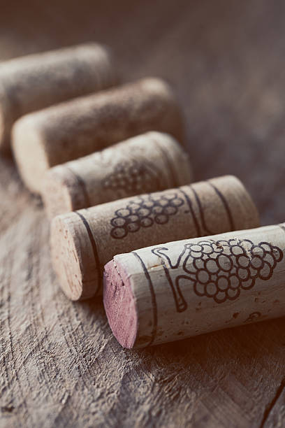 istock wine corks on old wooden background, selective focus point 637784060