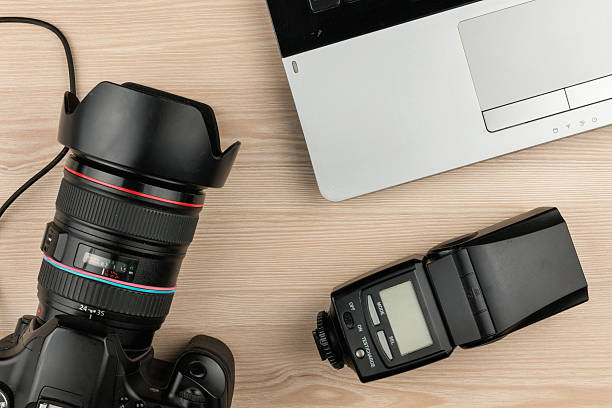 istock Working table photographer top view, wooden surface with laptop 637785630