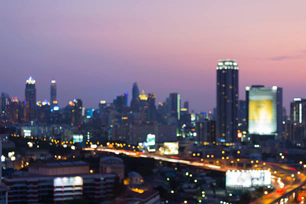 istock Blurred lights office building and highway night view 637785644
