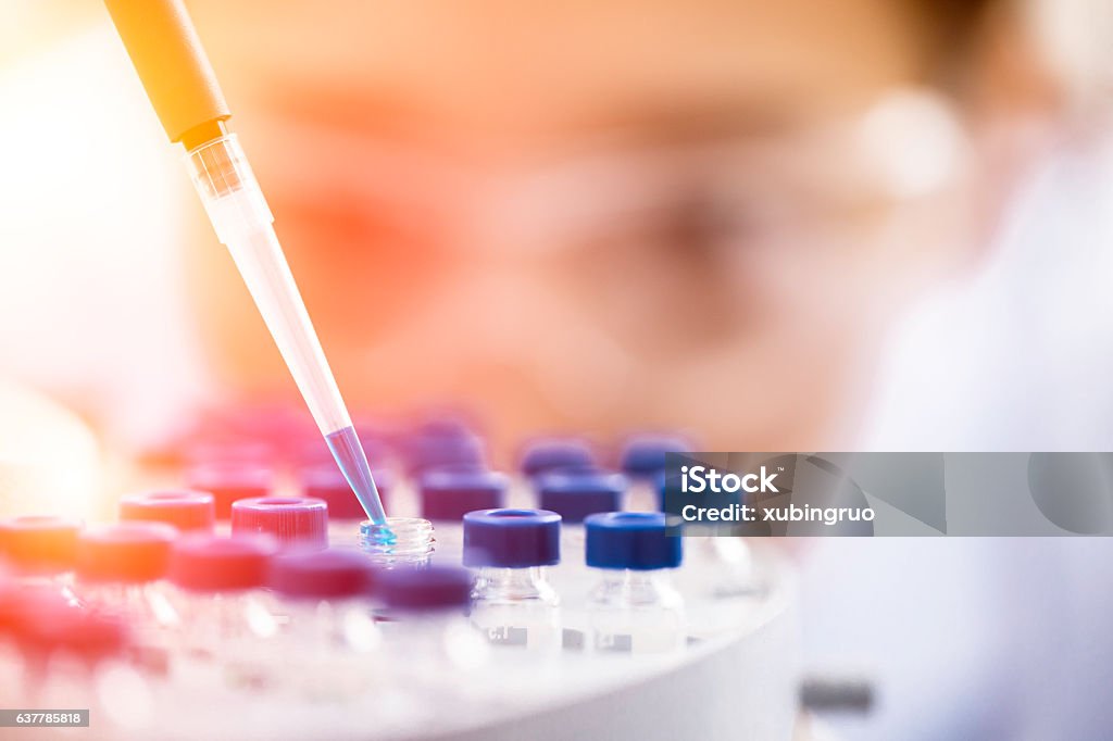 Female chemist at work in laboratory. Science Stock Photo
