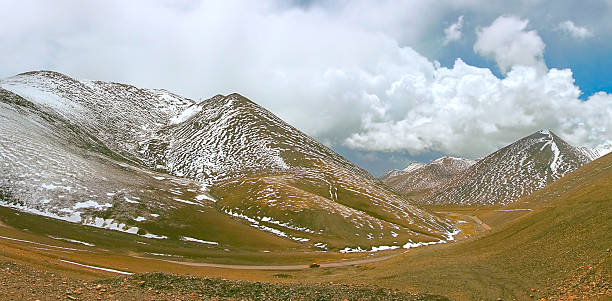 istock Moving car tavelling on winding mountain road 637785830