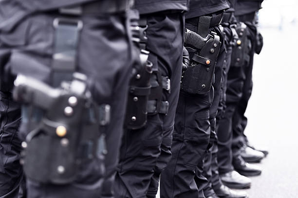 istock Special forces soldiers with pistols in scabbards 637786012