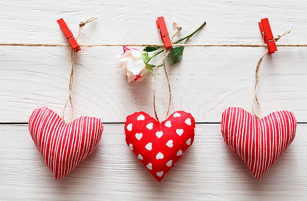 istock Valentine day background, pillow hearts border on wood 637787008