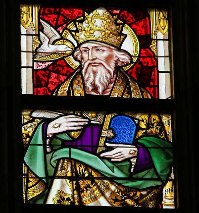Ghent, Belgium - December 23, 2016: Stained Glass window depicting Pope Saint Gregory I (Gregorius I), commonly known as Saint Gregory the Great, in the Cathedral of Saint Bavo in Ghent, Flanders, Belgium.
