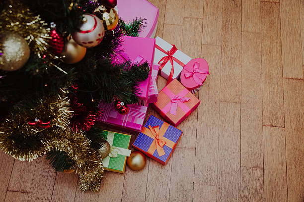 istock Christmas tree and presents in decorated living room 637789160